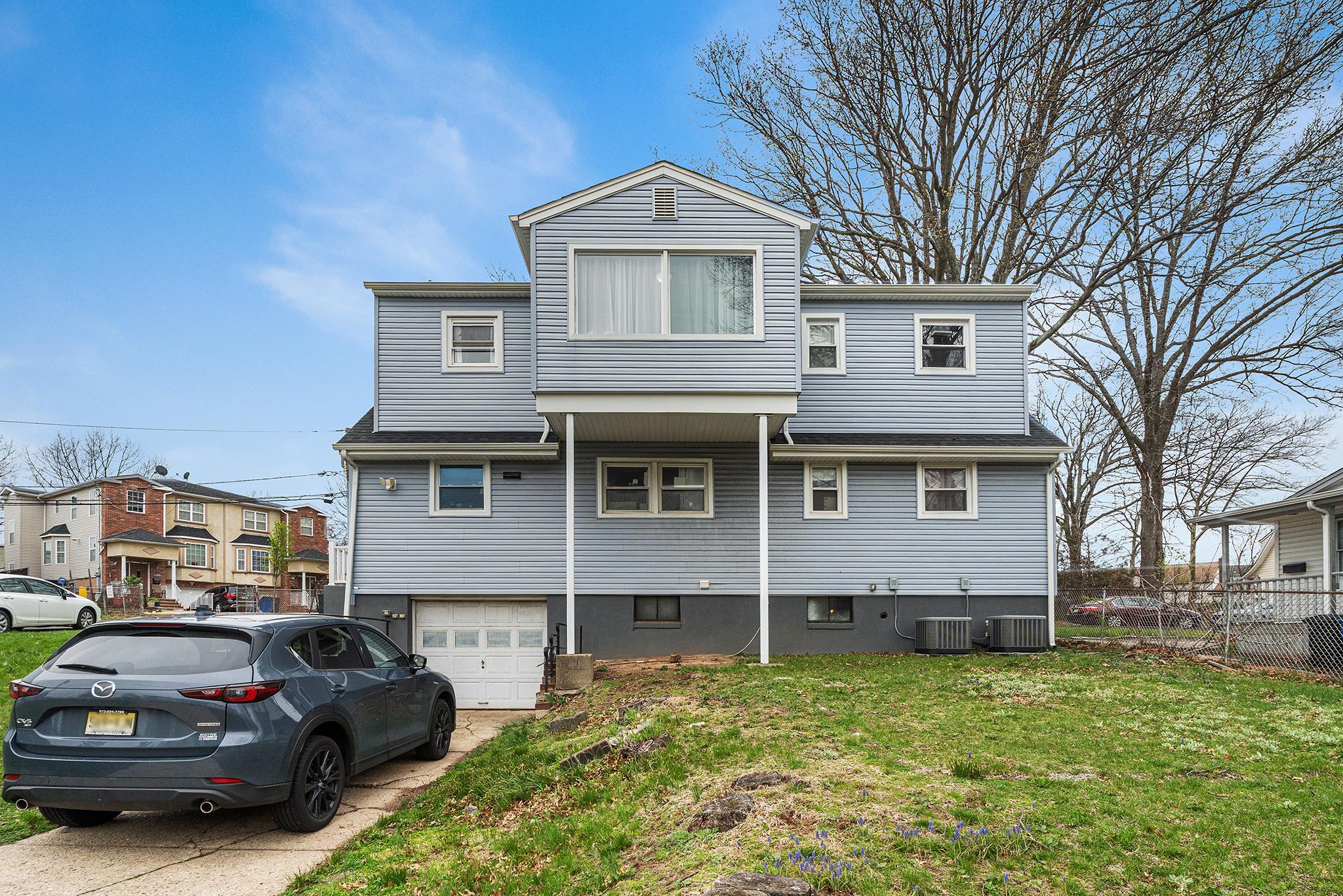 6 Mutillod Lane Secaucus, NJ 07094 - Photo 40 of 41 a front view of a house with a garden