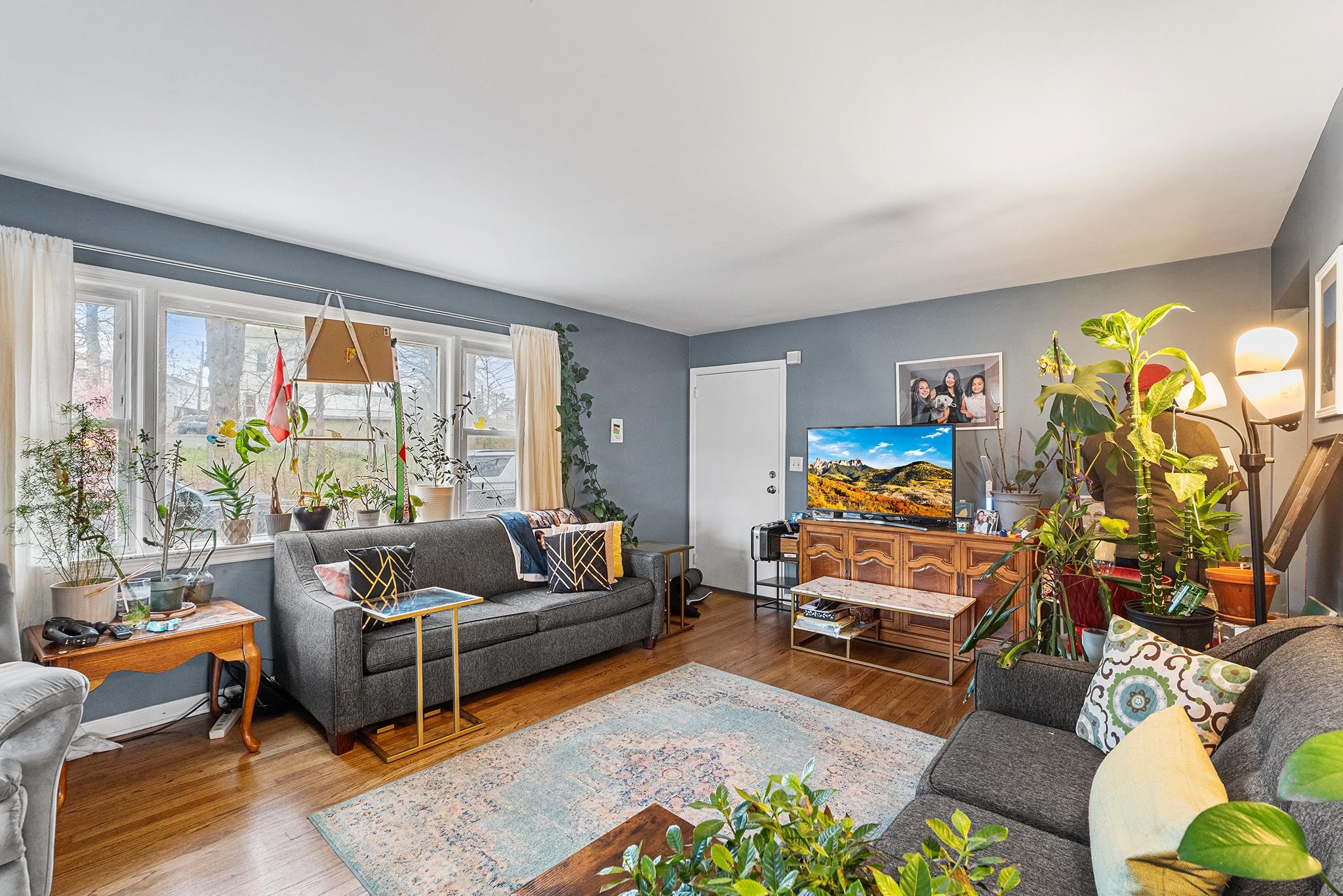 6 Mutillod Lane Secaucus, NJ 07094 - Photo 9 of 41 a living room with furniture and a flat screen tv