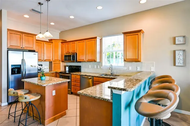 a very nice looking kitchen with a large window