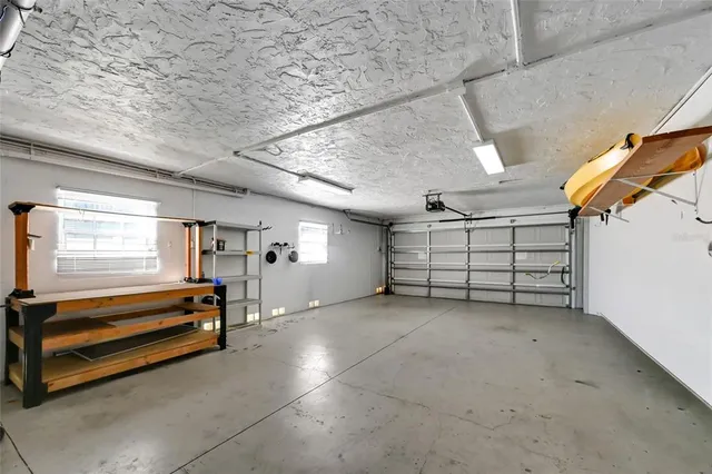 a view of room with air conditioner duct and windows