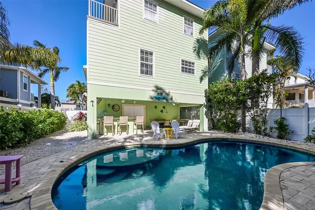 a view of a swimming pool with a patio