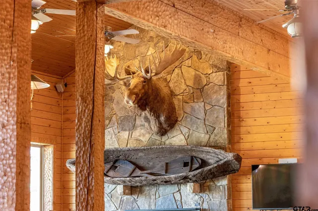 a bedroom with a bed a couch and a large window