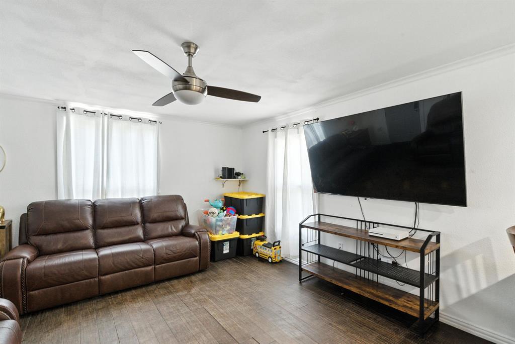 116 West 7th Street Weatherford, TX 76086 - Photo 12 of 26 a living room with furniture and a flat screen tv
