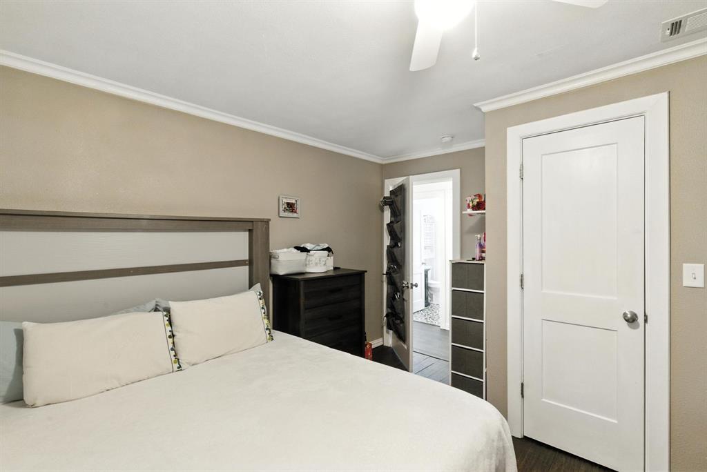 116 West 7th Street Weatherford, TX 76086 - Photo 21 of 26 a bedroom with a bed and a closet