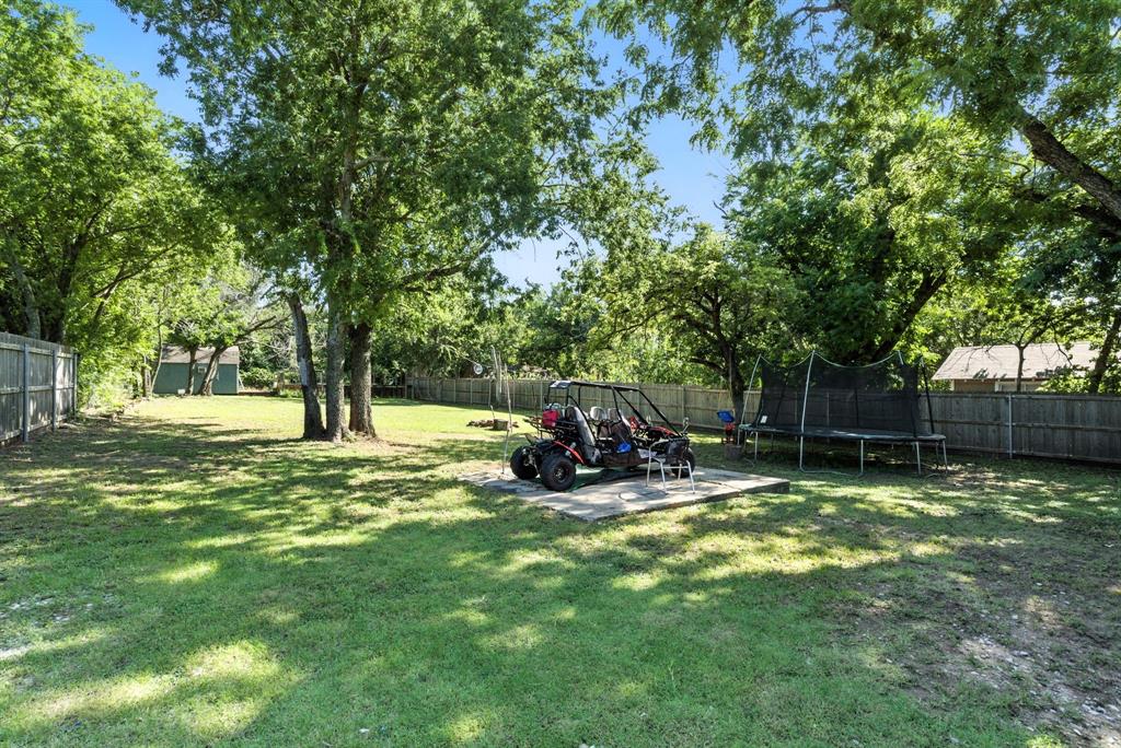 116 West 7th Street Weatherford, TX 76086 - Photo 24 of 26 a view of a park with large trees and a tree