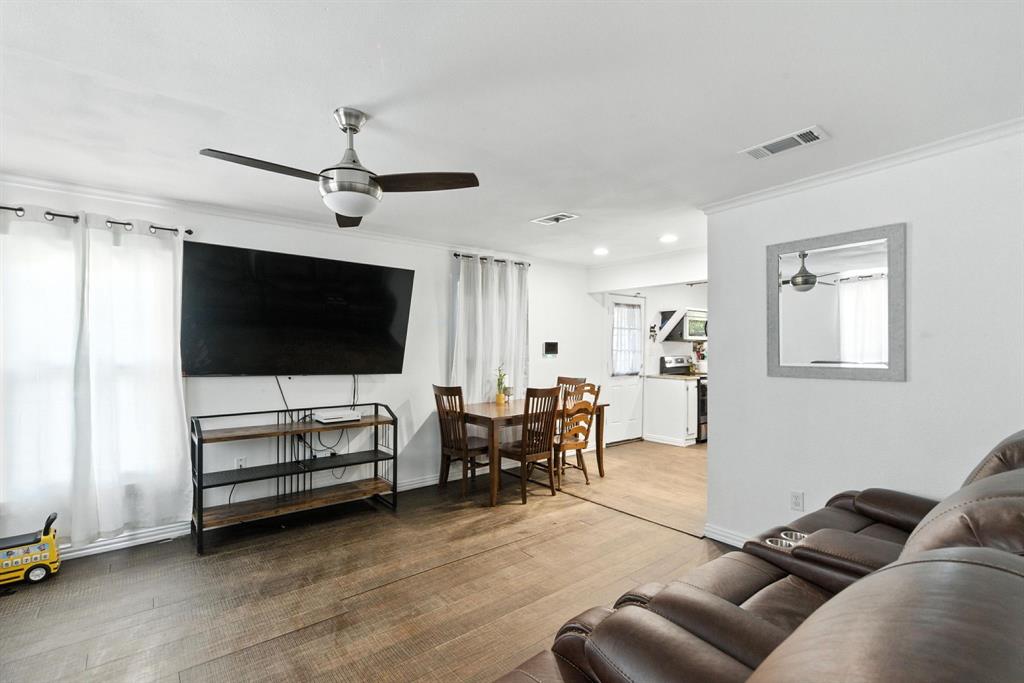 116 West 7th Street Weatherford, TX 76086 - Photo 6 of 26 a living room with furniture and a flat screen tv