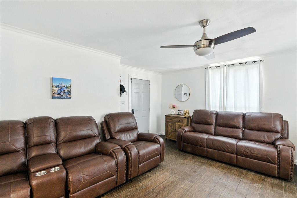 116 West 7th Street Weatherford, TX 76086 - Photo 10 of 26 a living room with furniture a couch and a window