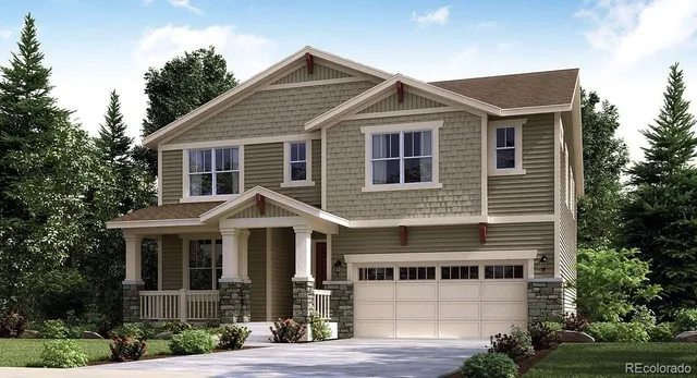 a front view of a house with yard and green space