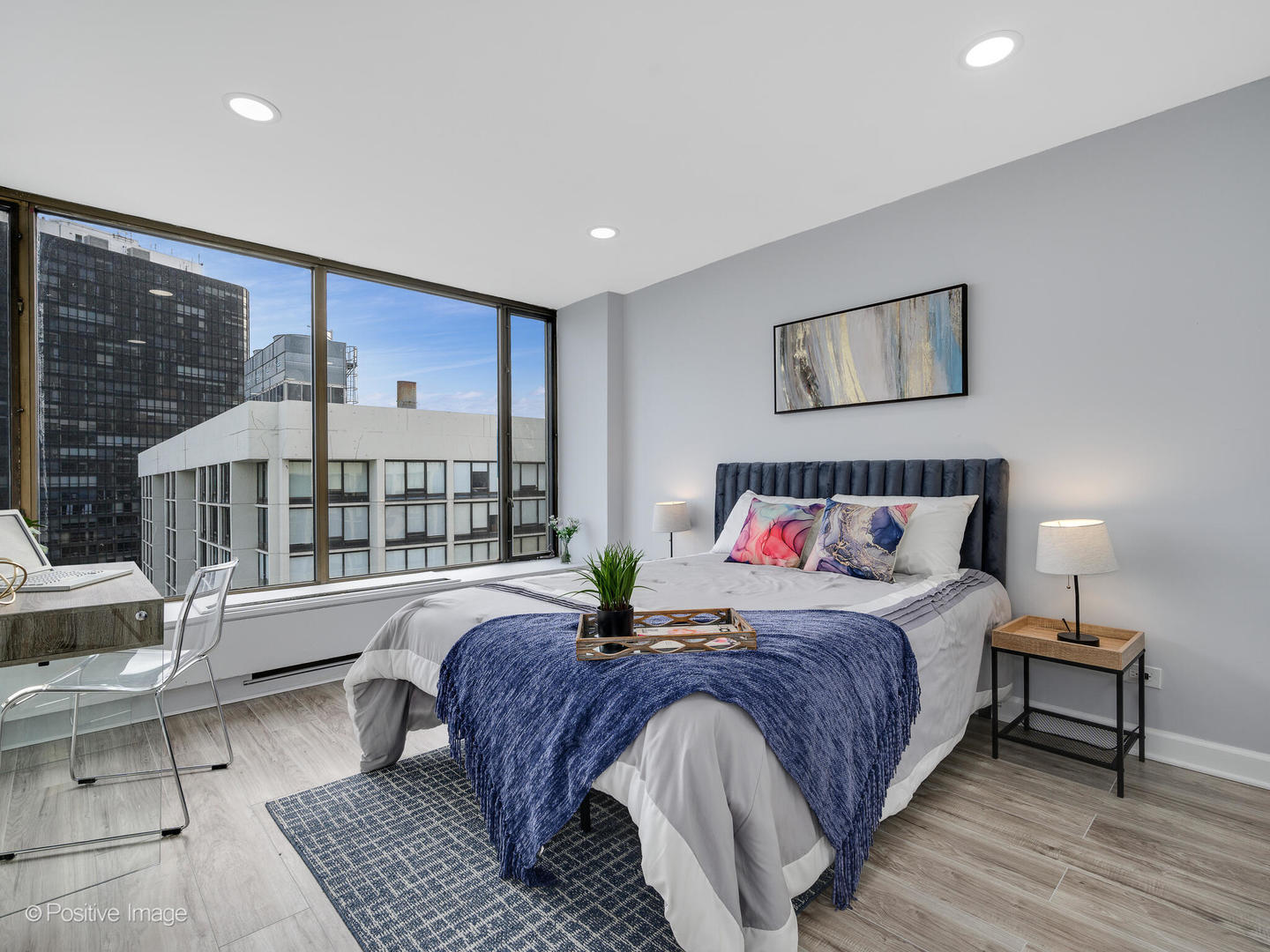 5455 North Sheridan Road, Unit 3906 Chicago, IL 60640 - Photo 12 of 24 a bedroom with a large bed and windows