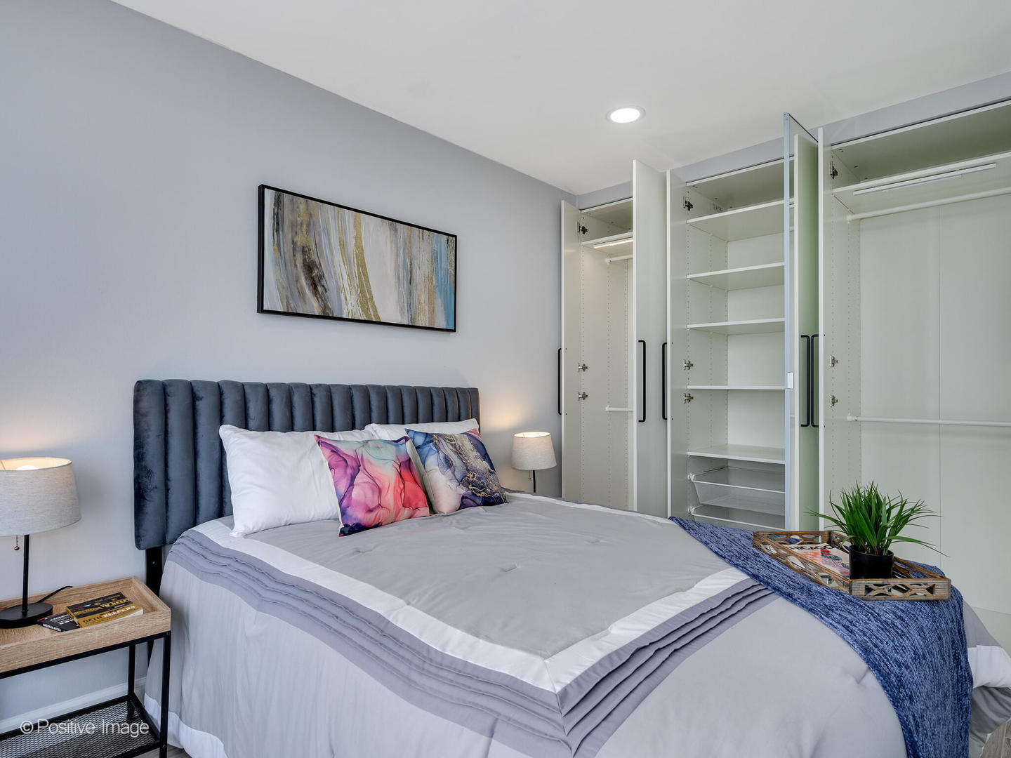 5455 North Sheridan Road, Unit 3906 Chicago, IL 60640 - Photo 14 of 24 a bedroom with a large bed and a potted plant