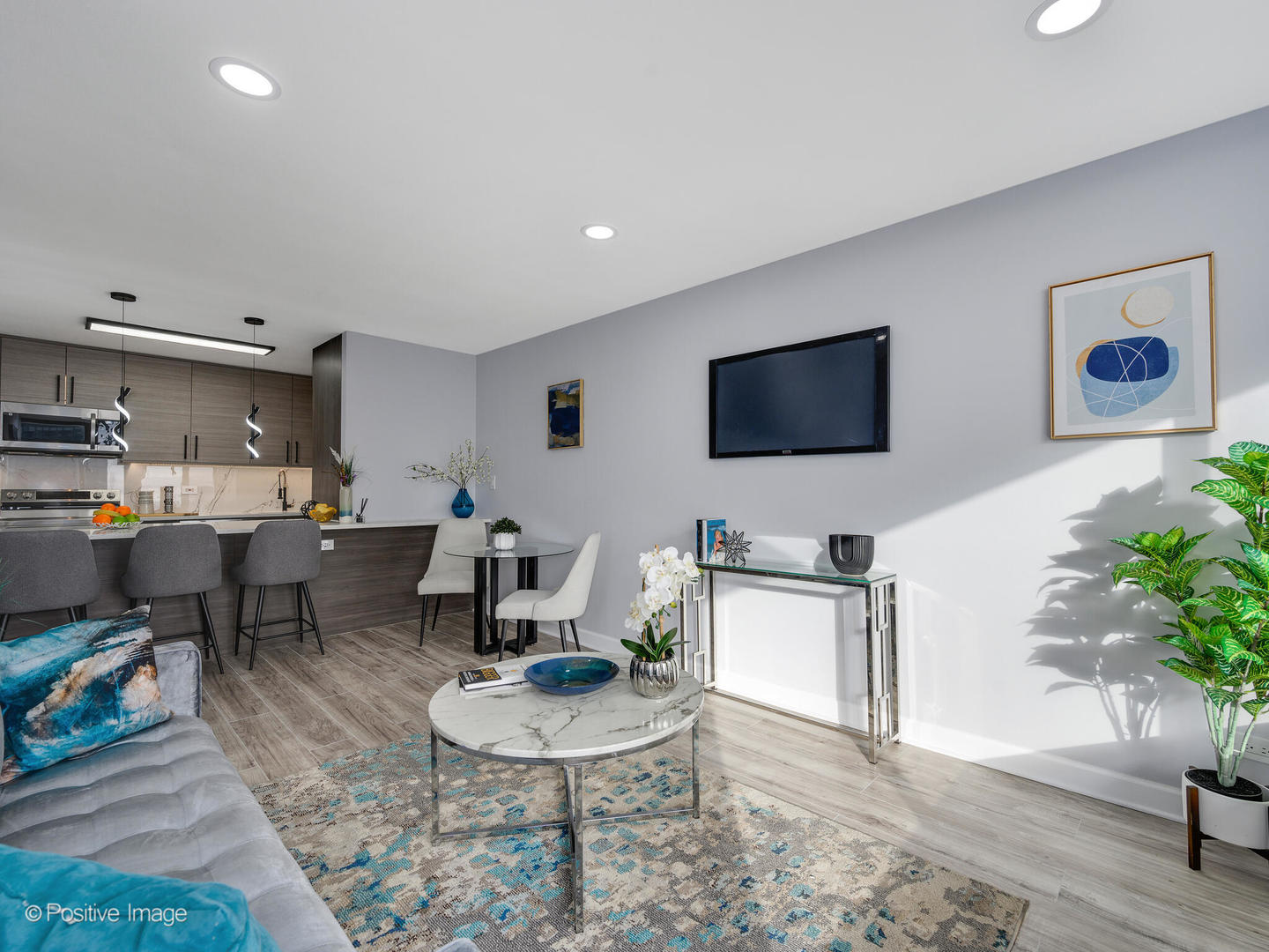 5455 North Sheridan Road, Unit 3906 Chicago, IL 60640 - Photo 9 of 24 a living room with furniture and a flat screen tv