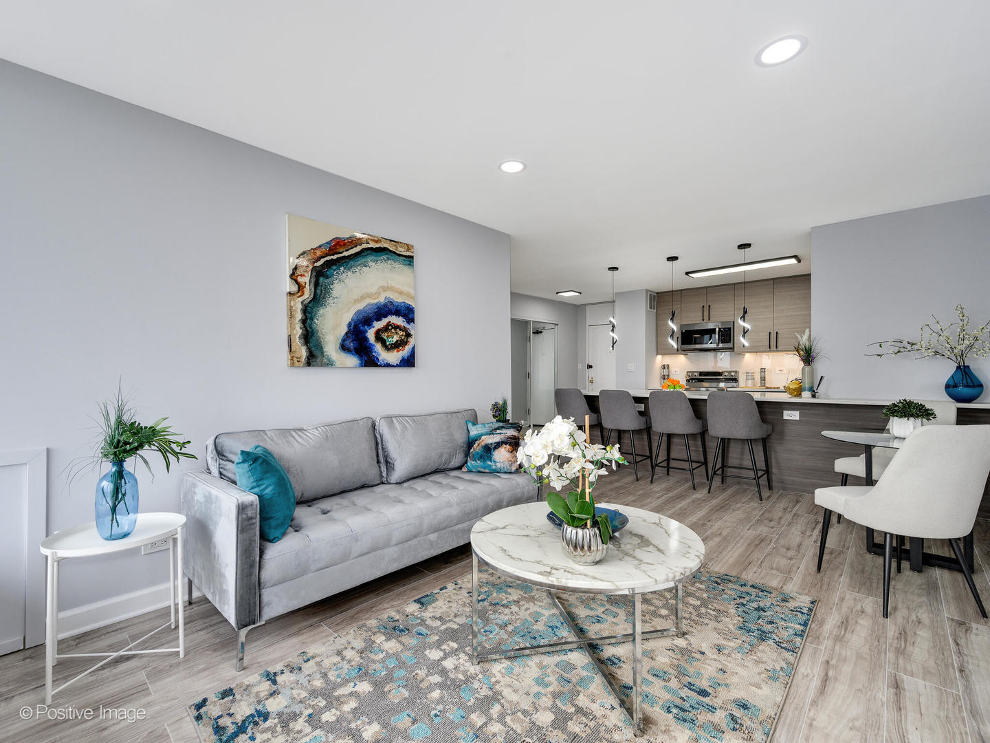 5455 North Sheridan Road, Unit 3906 Chicago, IL 60640 - Photo 10 of 24 a living room with furniture and wooden floor