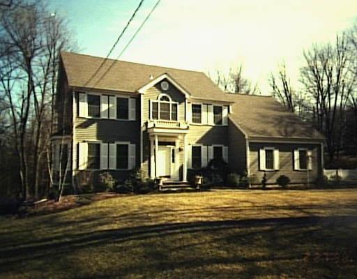 40 Powdermaker Drive Ridgefield, CT 06877 - Photo 1 of 1 a front view of a house with a yard