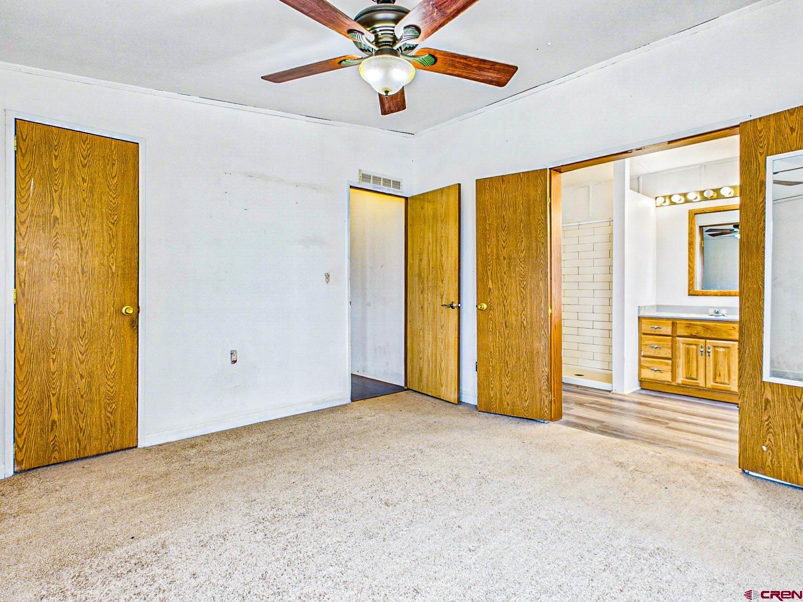 15484 Peach Road Cedaredge, CO 81413 - Photo 19 of 35 wooden floor in an empty room with a window