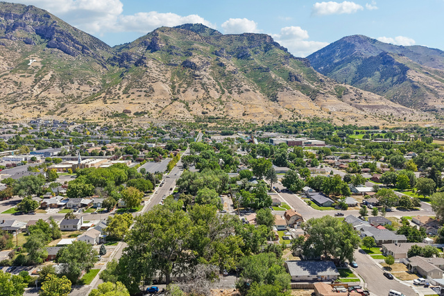 768 300 North Provo, UT 84606 - Photo 34 of 51 Expansive mountain backdrop with a developed residential area featuring mature trees and a clear sky