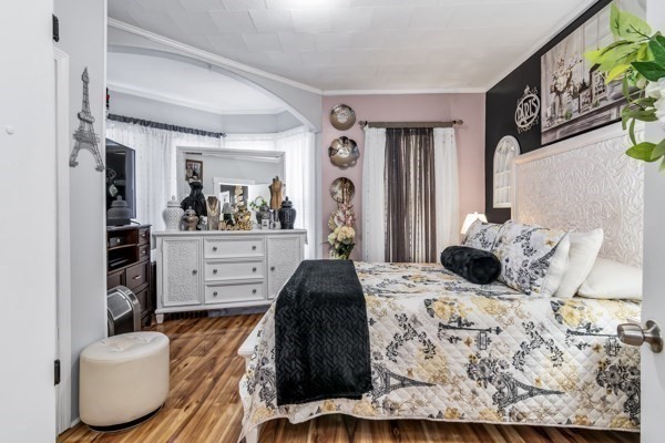 11 Cambridge Street Lawrence, MA 01843 - Photo 10 of 40 a bedroom with a bed and wooden floor