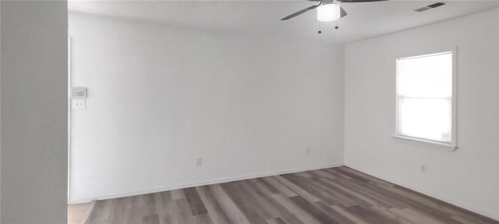 105 Anne Street Hampton, GA 30228 - Photo 11 of 15 an empty room with a window