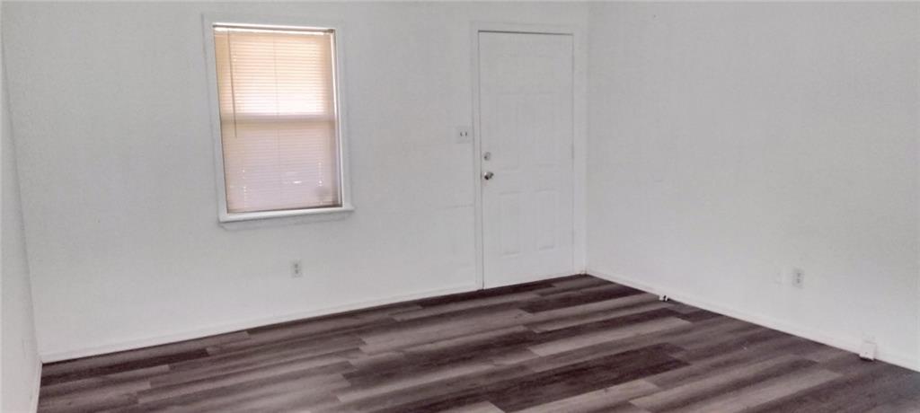 105 Anne Street Hampton, GA 30228 - Photo 12 of 15 a room with a empty space and a window