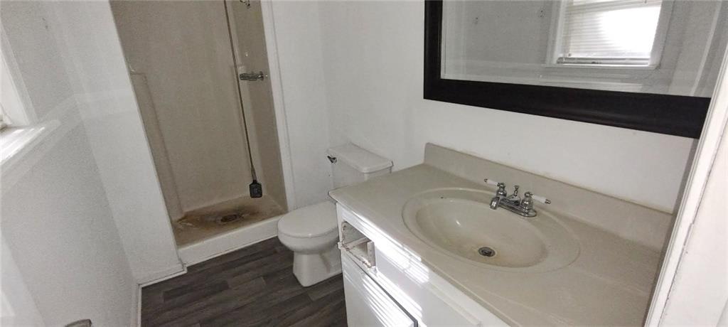 105 Anne Street Hampton, GA 30228 - Photo 13 of 15 a bathroom with a sink a toilet and tub