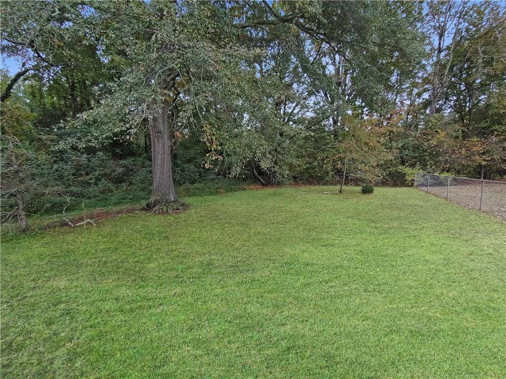 105 Anne Street Hampton, GA 30228 - Photo 15 of 15 a view of a field with a tree