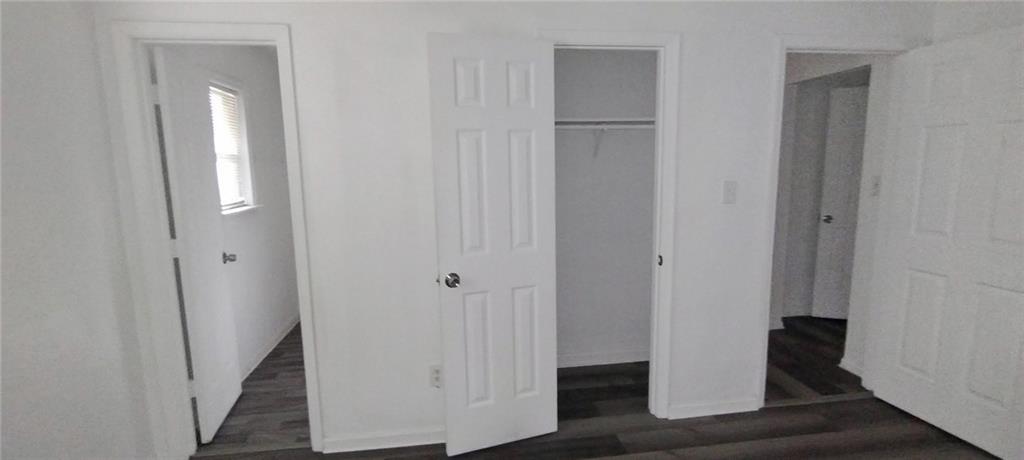 105 Anne Street Hampton, GA 30228 - Photo 7 of 15 a view of a hallway with wooden floor