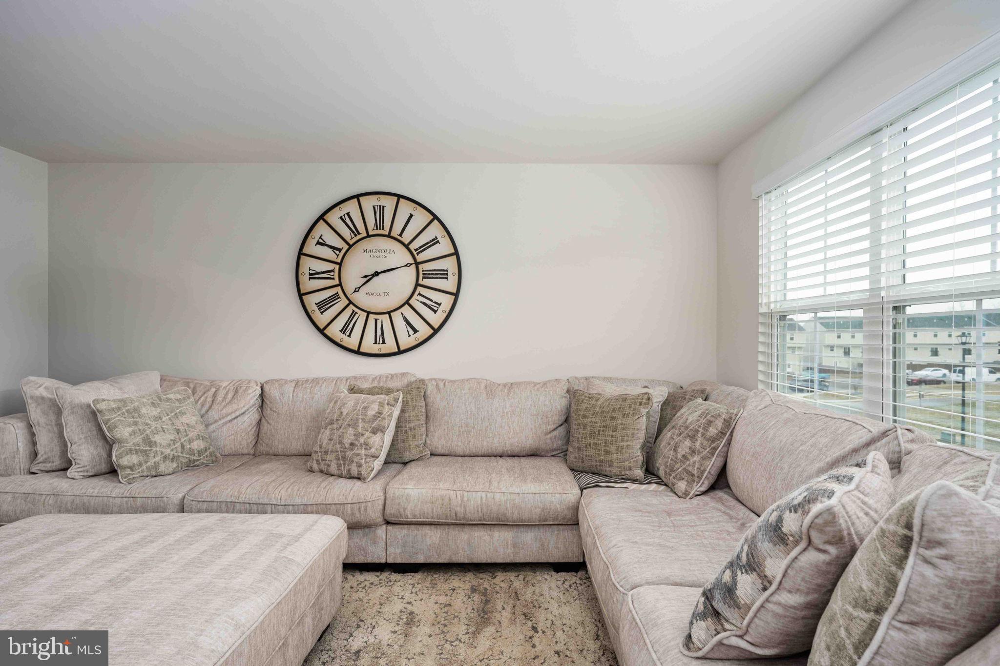 2840 Farzi Circle Locust Grove, VA 22508 - Photo 14 of 48 a living room with a couch and a large window