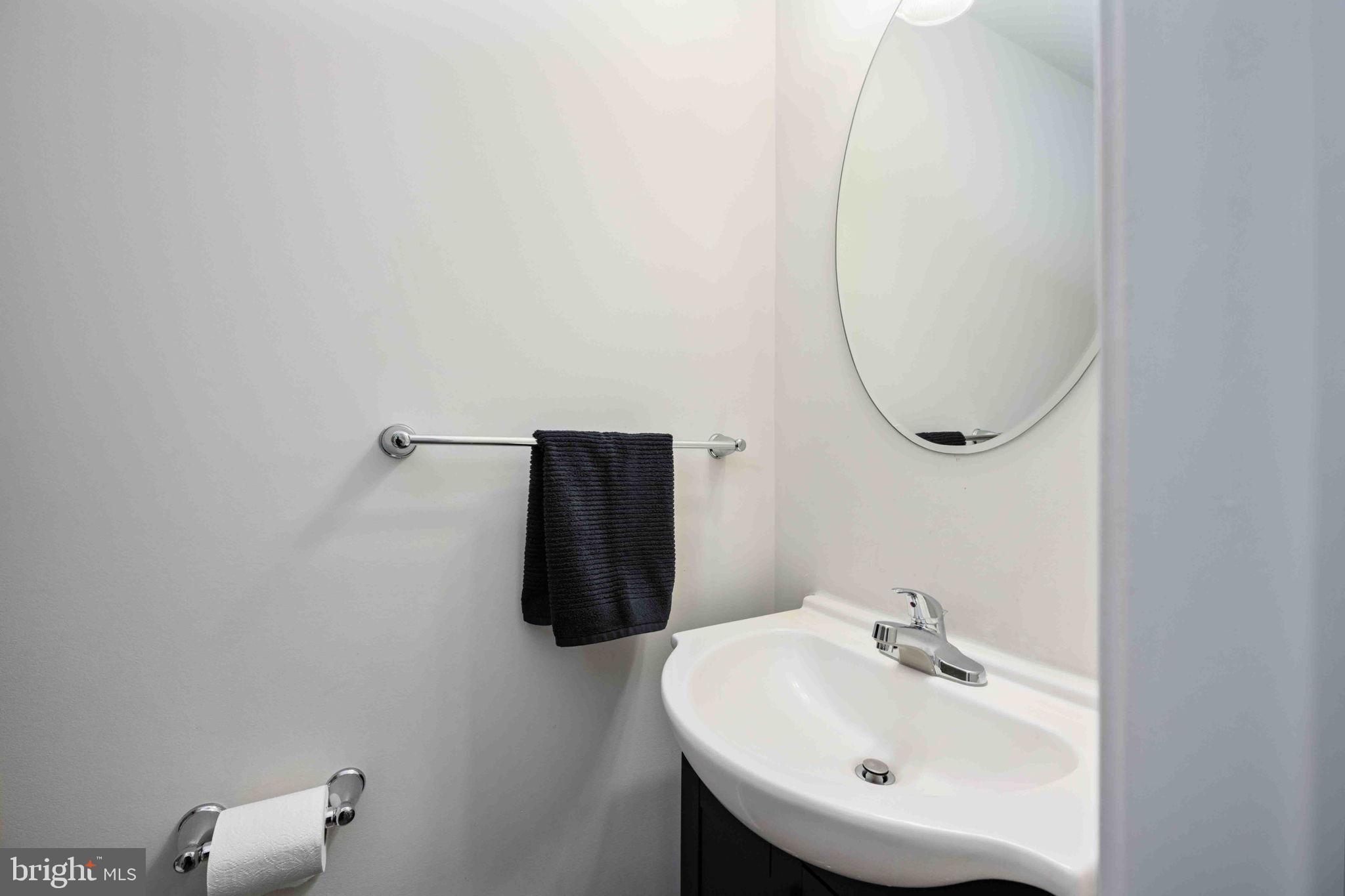 2840 Farzi Circle Locust Grove, VA 22508 - Photo 23 of 48 a bathroom with a sink and mirror