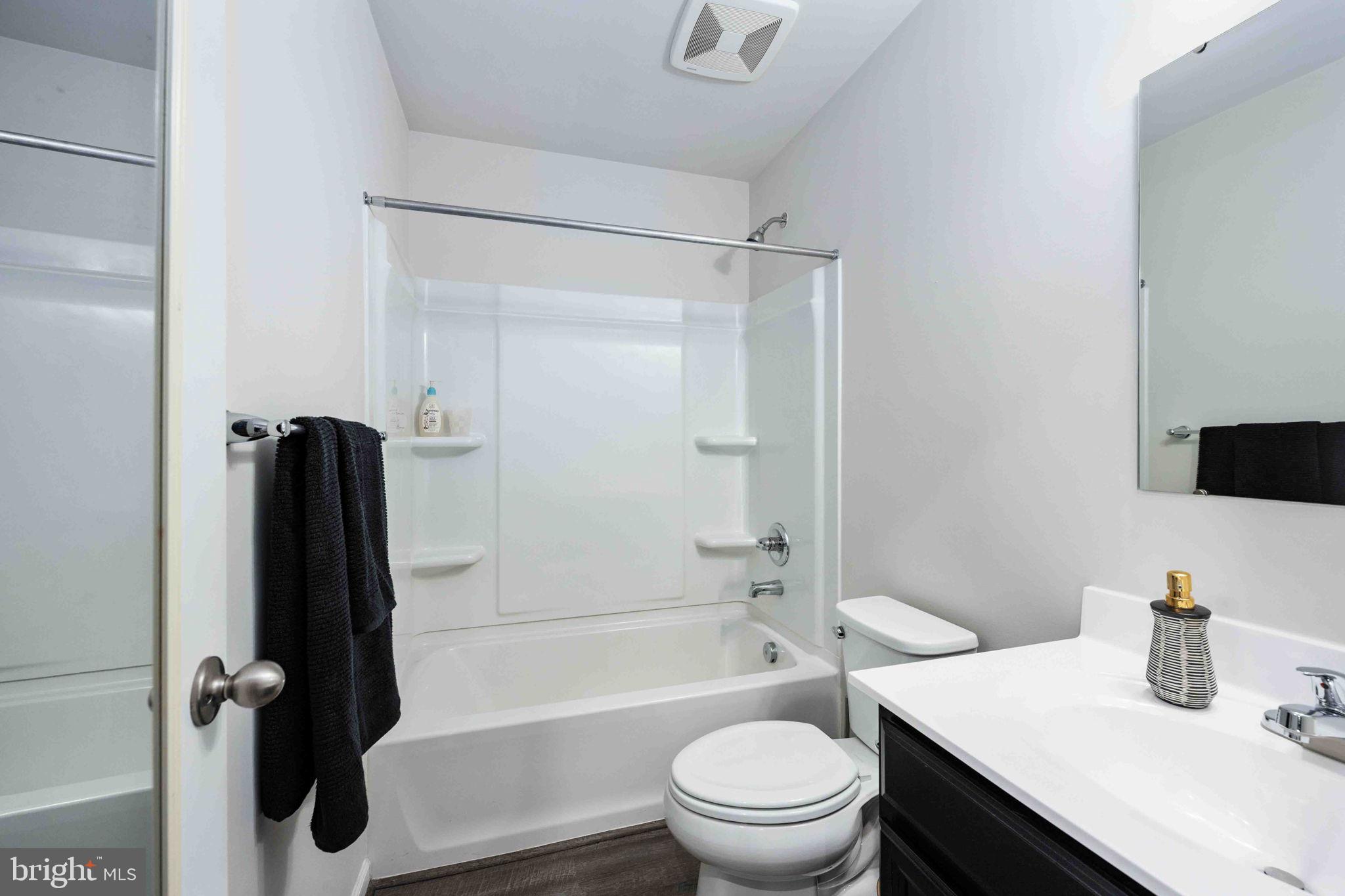 2840 Farzi Circle Locust Grove, VA 22508 - Photo 32 of 48 a bathroom with a sink a toilet and shower