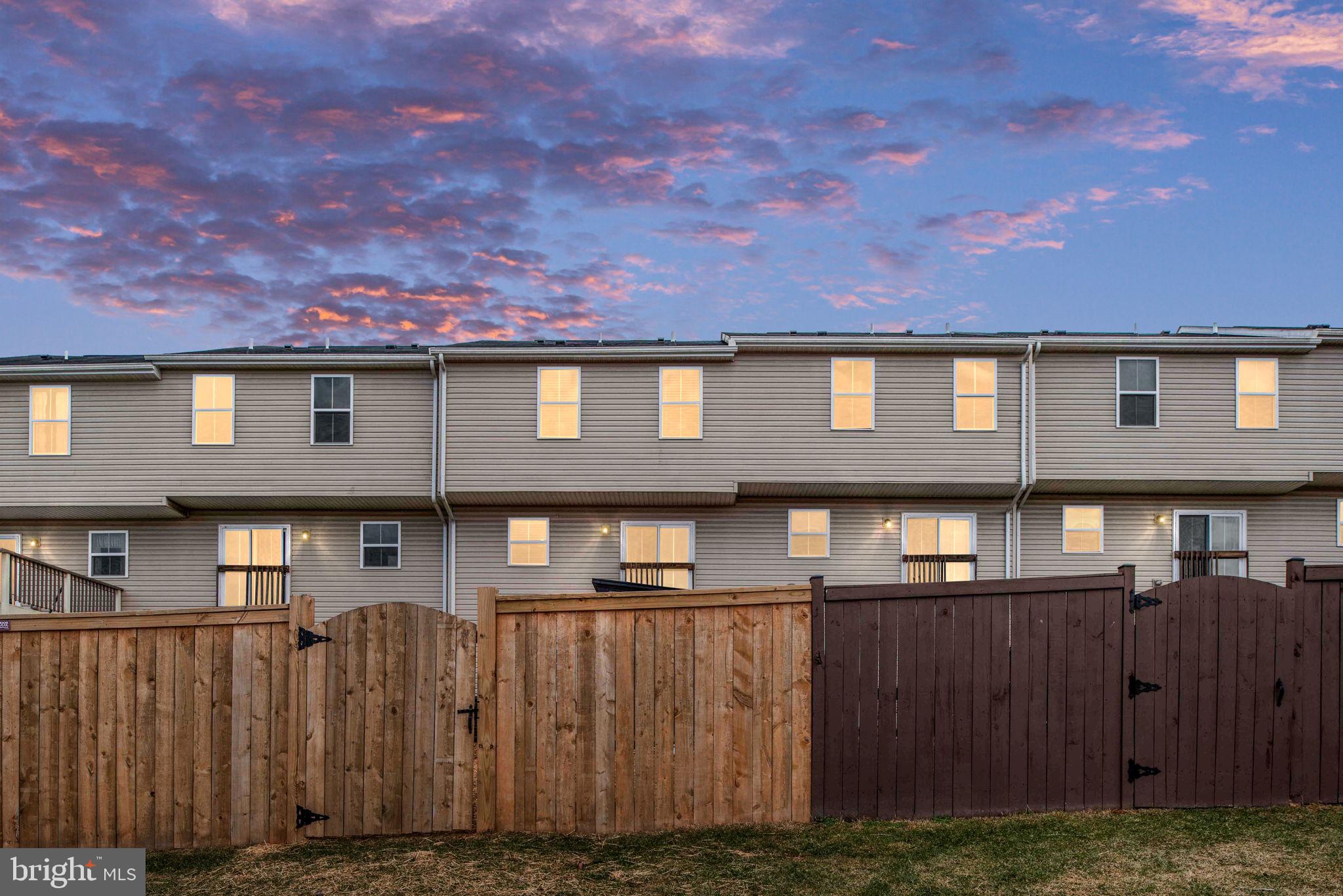 2840 Farzi Circle Locust Grove, VA 22508 - Photo 5 of 48 a front view of a house with a yard
