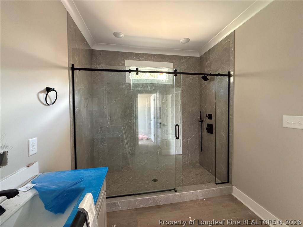 132 Ridge Stone Drive Autryville, NC 28318 - Photo 14 of 26 a bathroom with a glass shower door