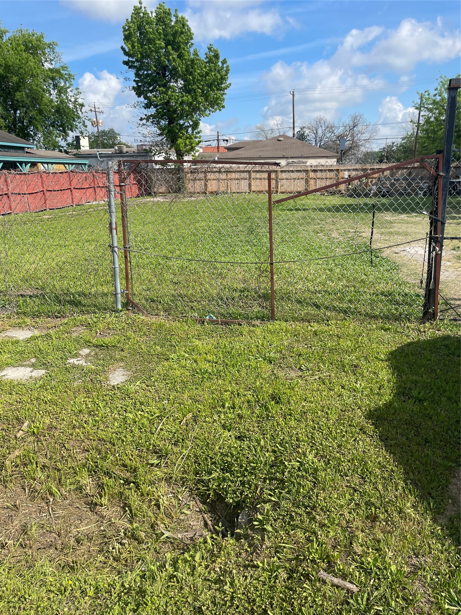 Vacant lot - on the left side of the fence - roughly 50 feet of frontage, 100 feet of depth