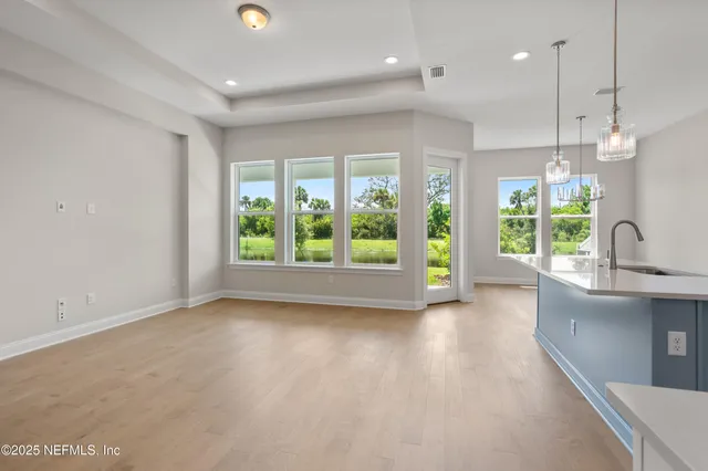 a bathroom with a double vanity sink mirror and shower