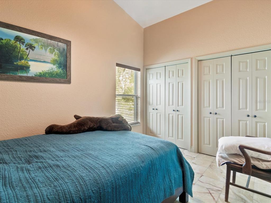 10820 Southwest 31st Way Webster, FL 33597 - Photo 31 of 37 a bedroom with a bed and a window