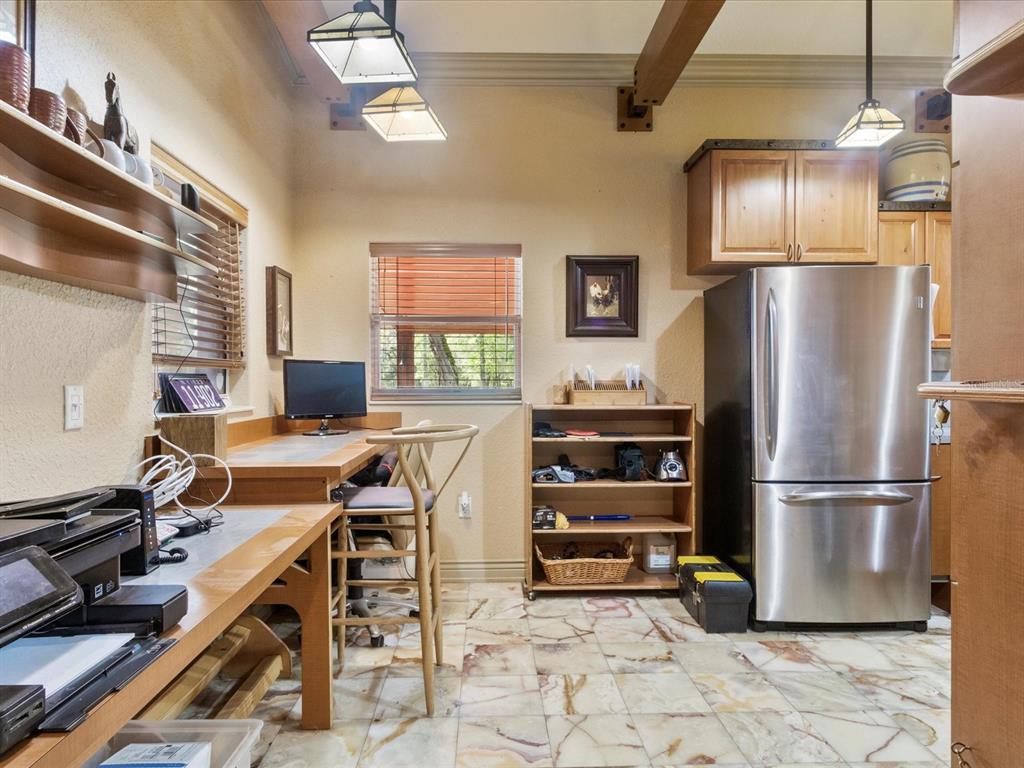 10820 Southwest 31st Way Webster, FL 33597 - Photo 33 of 37 a kitchen with a refrigerator and a stove top oven