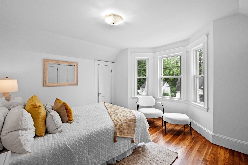 33 Intervale Avenue Saugus, MA 01906 - Photo 18 of 40 a bedroom with a bed and wooden floor