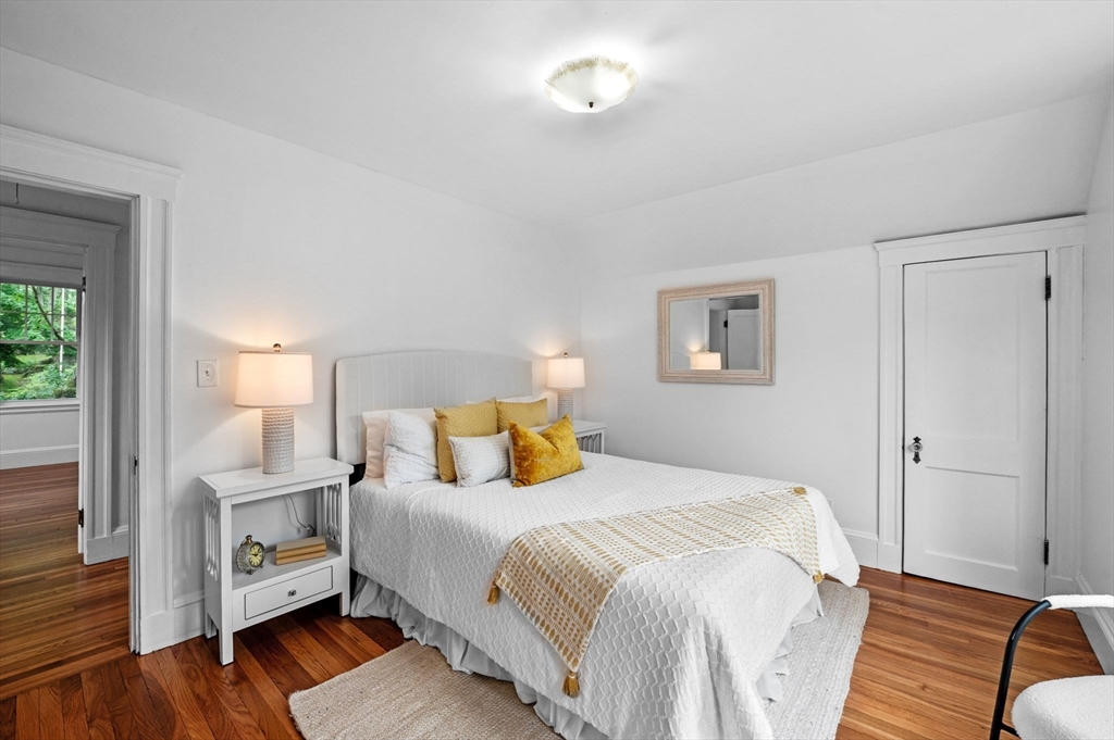 33 Intervale Avenue Saugus, MA 01906 - Photo 19 of 40 a bedroom with a bed and a lamp