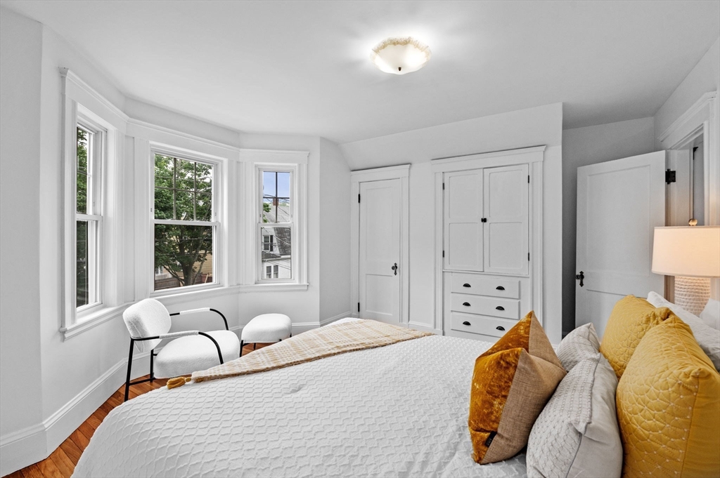 33 Intervale Avenue Saugus, MA 01906 - Photo 20 of 40 a bedroom with a bed and wooden floor