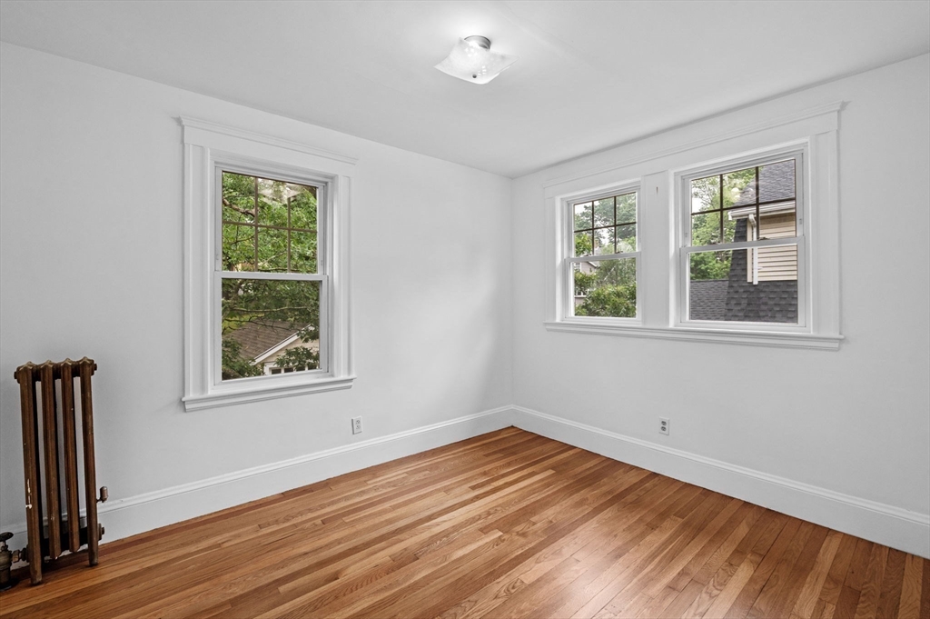 33 Intervale Avenue Saugus, MA 01906 - Photo 23 of 40 a view of empty room with wooden floor and fan