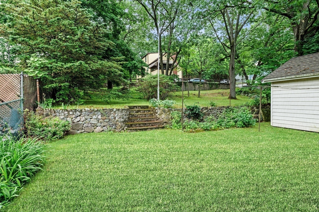 33 Intervale Avenue Saugus, MA 01906 - Photo 29 of 40 a backyard of a house with lots of green space
