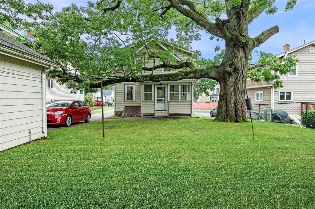 33 Intervale Avenue Saugus, MA 01906 - Photo 30 of 40 a front view of a house with a garden and trees
