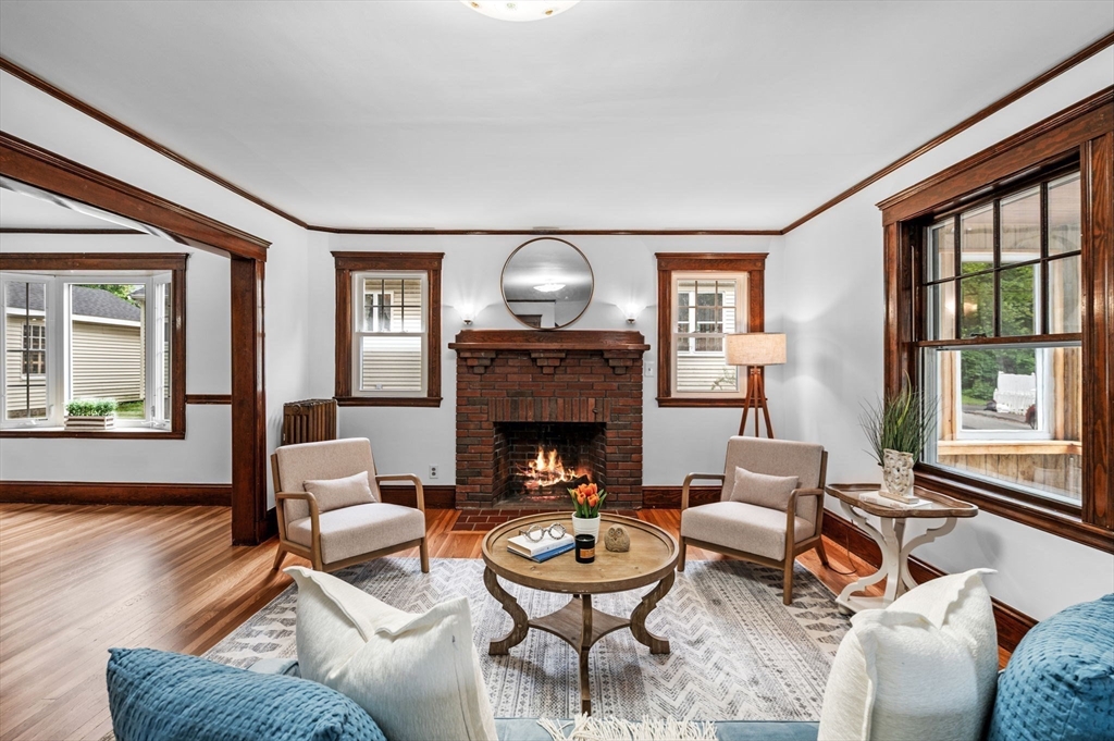 33 Intervale Avenue Saugus, MA 01906 - Photo 4 of 40 a living room with furniture a fireplace and wooden floor