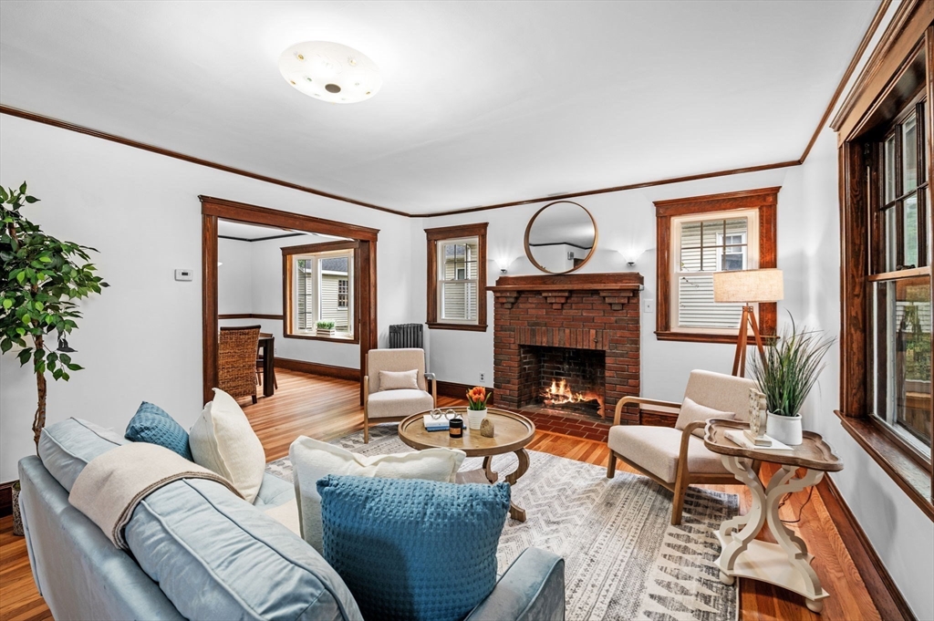 33 Intervale Avenue Saugus, MA 01906 - Photo 5 of 40 a living room with furniture a fireplace and a potted plant