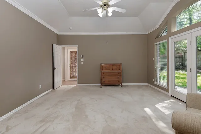 a view of an empty room with windows