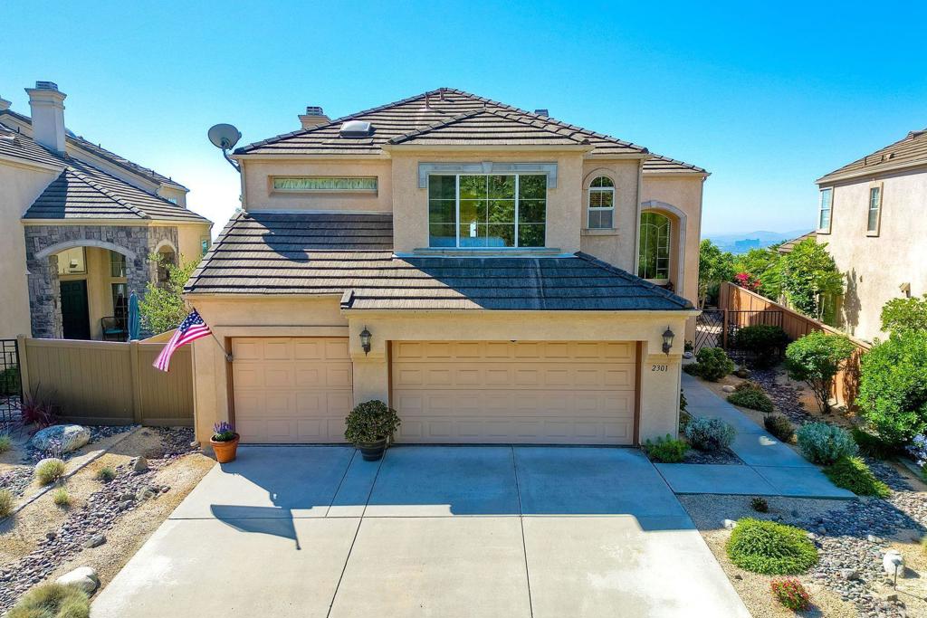 2301 Canyon View Escondido, CA 92026 - Photo 1 of 1 a view of a white house with wooden walls and potted plants