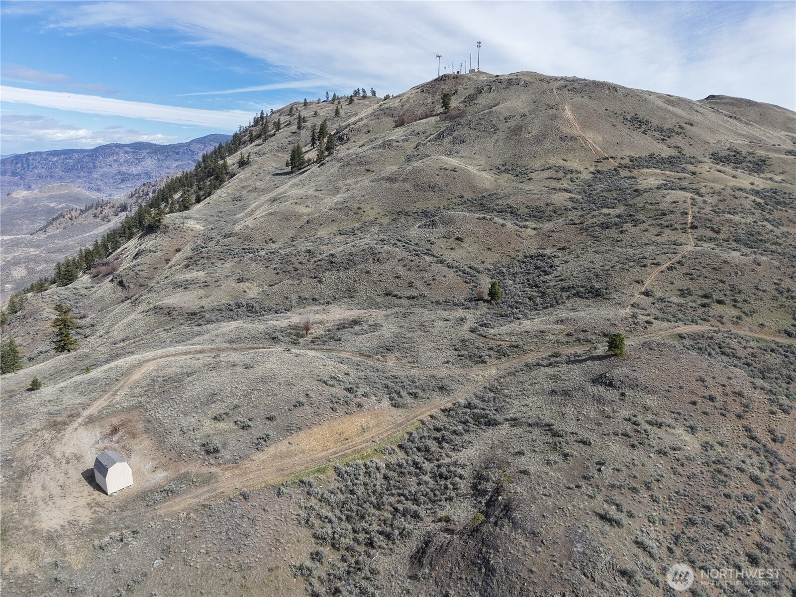 -xxx Emily Road Tonasket, WA 98855 - Photo 27 of 31 a view of a dry yard with mountains in the background