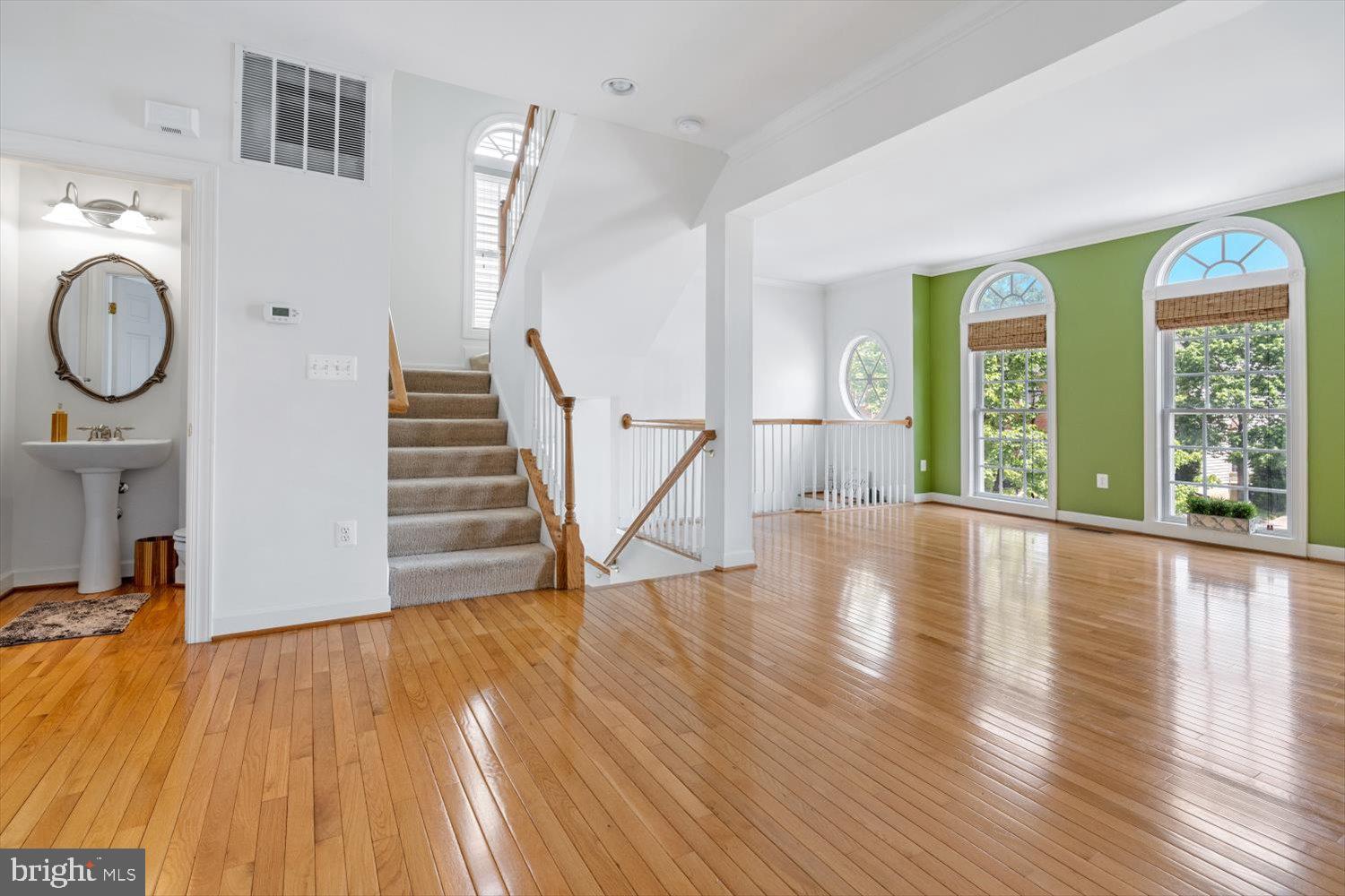 Spacious living room w/  gleaming hardwood floors