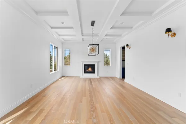 a large kitchen with lot of wooden cabinets and stainless steel appliances
