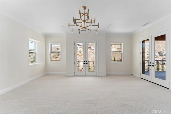 a picture of a door of a house with a yard