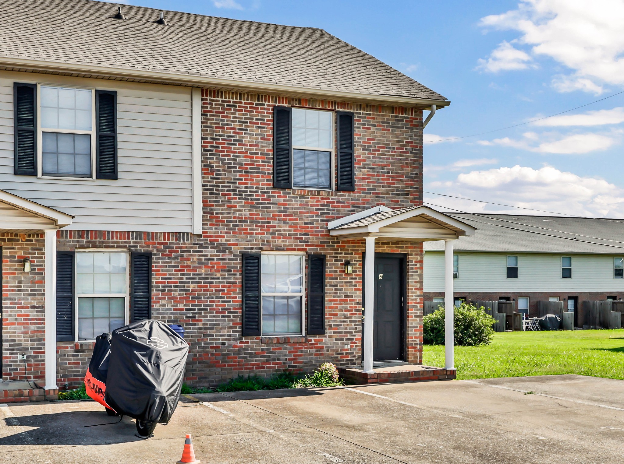 2451 Wilson Road, Unit 6 Clarksville, TN 37043 - Photo 21 of 21 a front view of a house with a yard and garage