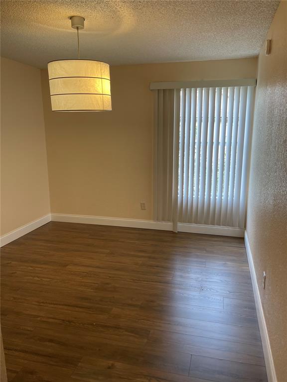 5144 Conroy Road, Unit 32 Orlando, FL 32811 - Photo 11 of 16 a view of a room with wooden floor